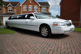 Select limos 8 passenger white limousine for proms and weddings